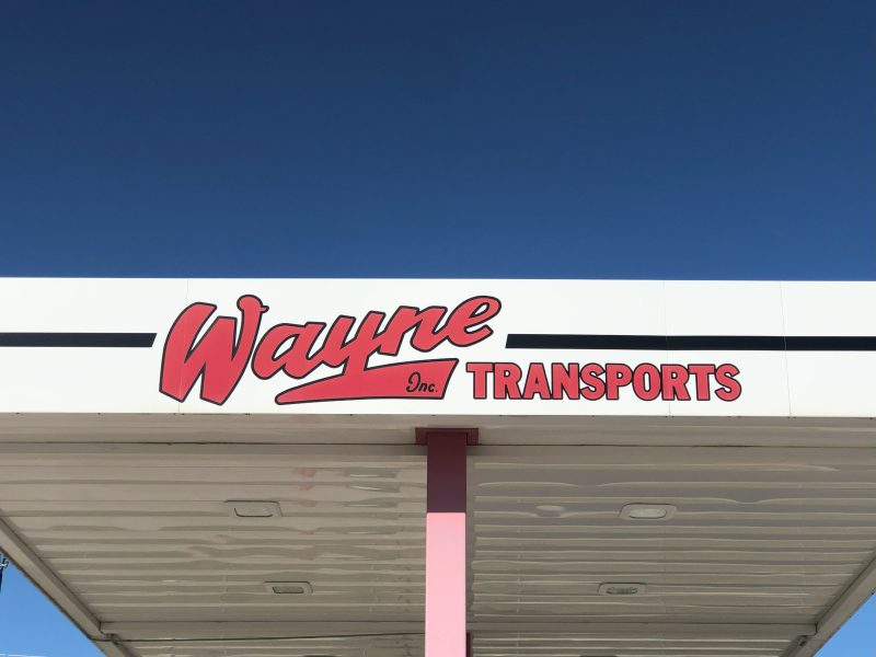 Wayne transports sign