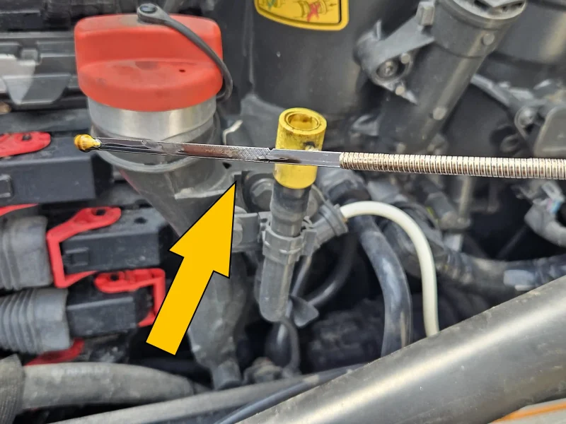 Check the oil level on the dipstick pre-trip inspection